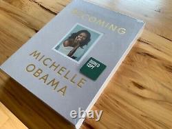 Édition de luxe reliée en tissu signée par Michelle Obama de 'Devenir' sous scellé, neuf.